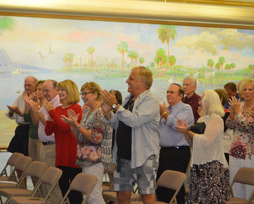 Attendees clap for Michelle Giglio and Lee Dougherty Ross after their performance.