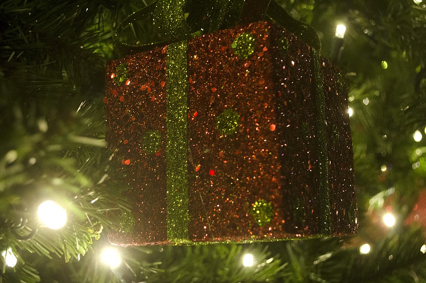 Christmas present ornaments decorate the downtown Christmas tree.