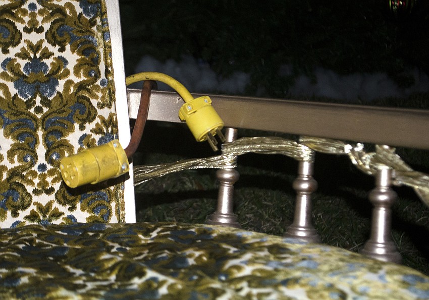 Two ends of an extension cord lay draped over Santa'       s throne before the downtown tree lighting.