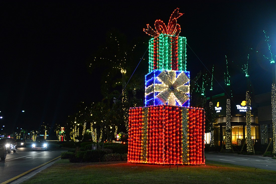 Thousands of lights go up around the University Town Center shopping plazas each Christmas season. File photo.