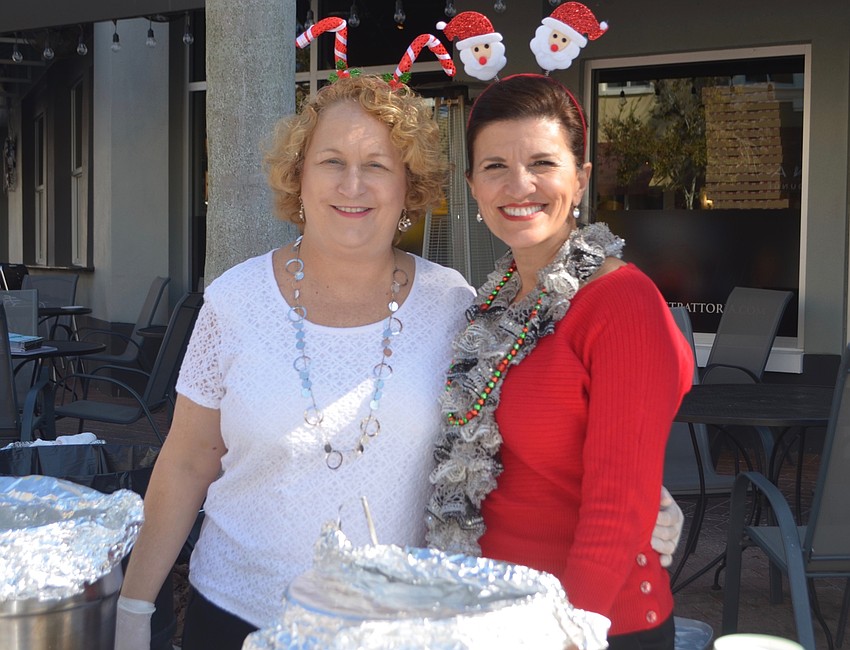 Caryn Hodge of The Beach House Restaurant and Kaiser' s Violeta Huesman enjoy the event.