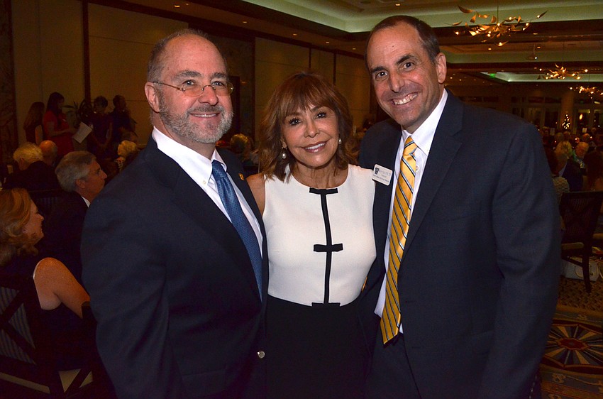 Kirk and Chris Voelker with President of Sarasota Memorial Healthcare Foundation Mason Ayers