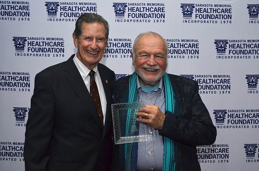 Chairman of the Sarasota Memorial Healthcare Foundation Board of Trustees Jim Syprett with Bob Bartner, outgoing foundation trustee