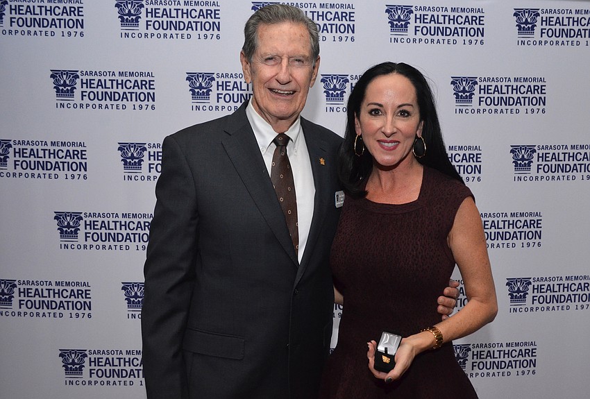 Chairman of the Sarasota Memorial Healthcare Foundation Board of Trustees Jim Syprett with Ashley Kozel, new Corinthian Society inductee