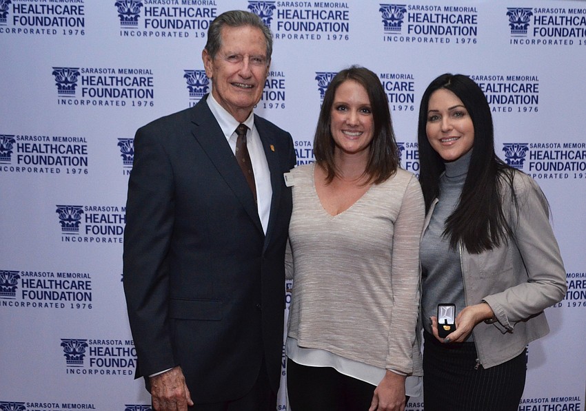 Chairman of the Sarasota Memorial Healthcare Foundation Board of Trustees Jim Syprett with Jen Rust and Salena Wilhoit