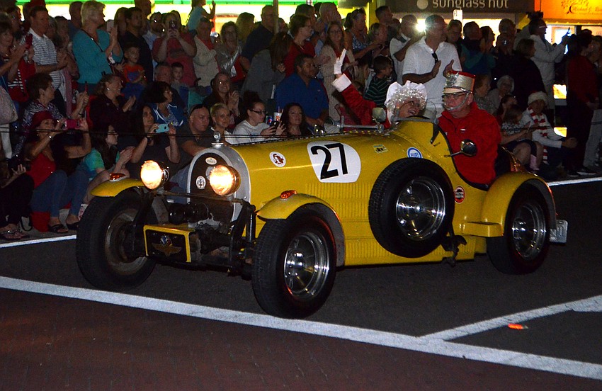 Mrs. Claus waves to the crowd as she arrives at the 38th Annual Holiday Night on St. Armands.