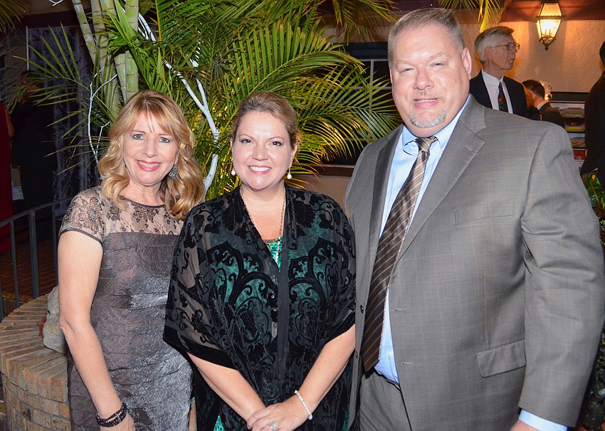 Florida Center Chief Development Officer Stacy Pinkerton with Veronica Brandon Miller and her husband, Jeremy Miller