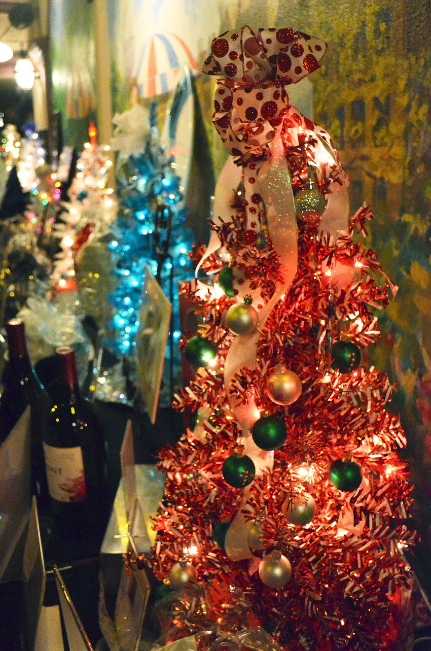 The Sweet Tooth Tree had a starting bid of $50 and featured candy cane-themed ornaments.