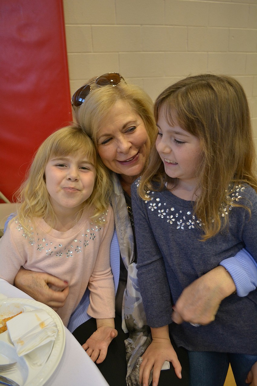 Robbi Karis, center, attends with her granddaughters, Kamryn Foos, 5, and Khloe Foos, 7. Her husband, Frank Foos spoke at the luncheon.