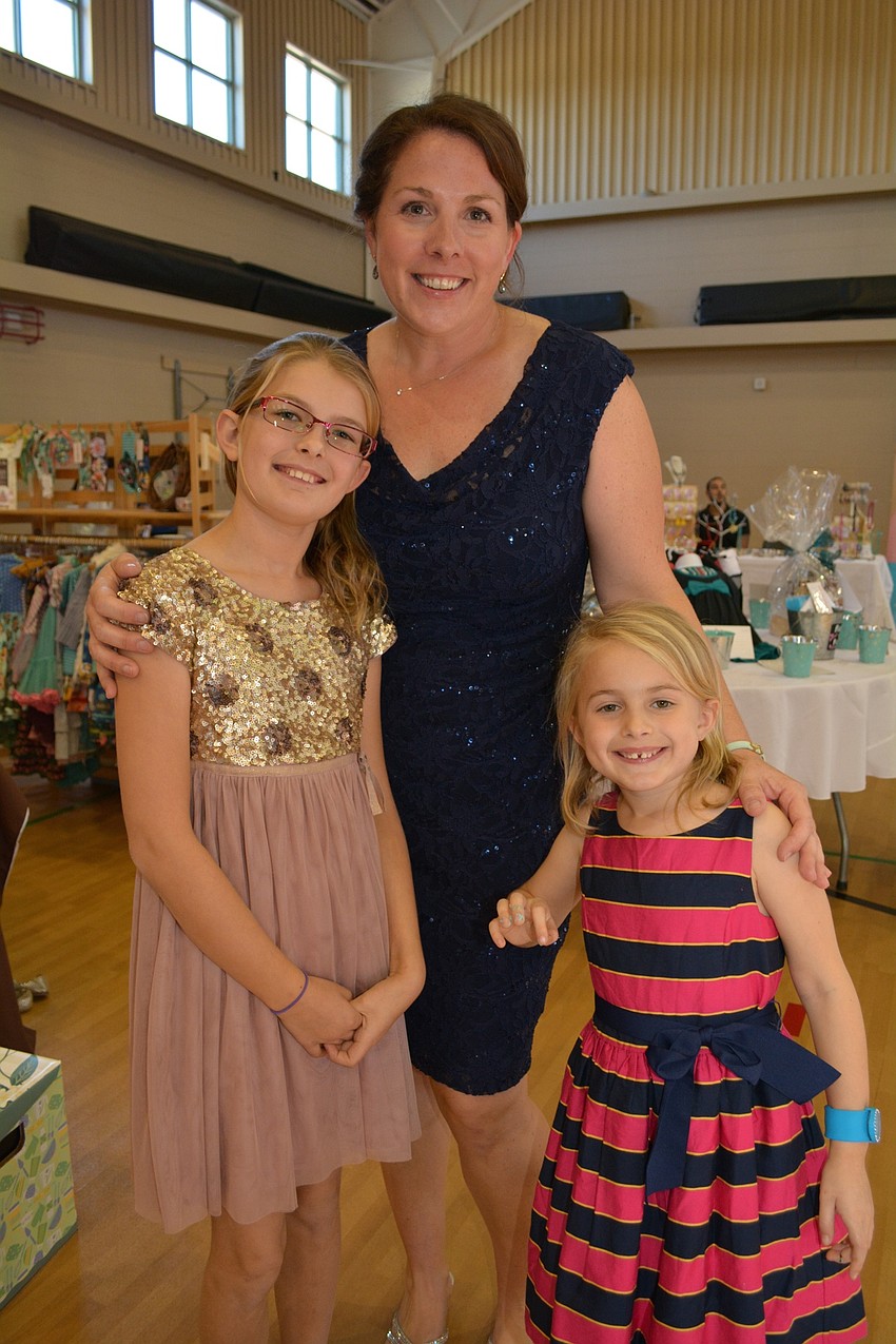 Event co-chairwoman Jen Kovatch, of Lakewood Ranch, finds her daughters, Shelby, 10, and Cora, 6, for a photo. Cora Kovatch says her mom did a really good job.