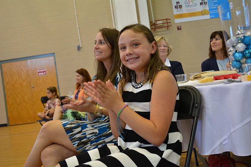 Nine-year-old Amanda Renteria, of Greenbrook, claps for models.