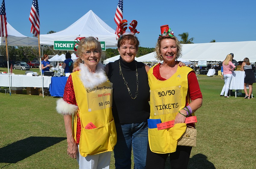Lynn Larson, Riana Rawson and Christine Olsen sold tickets for the “Edith Barr Dunn Memorial 50/50 Raffle.”