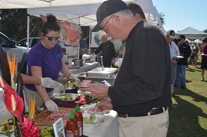 John Alexander grabs food from Island Time Bar & Grill.