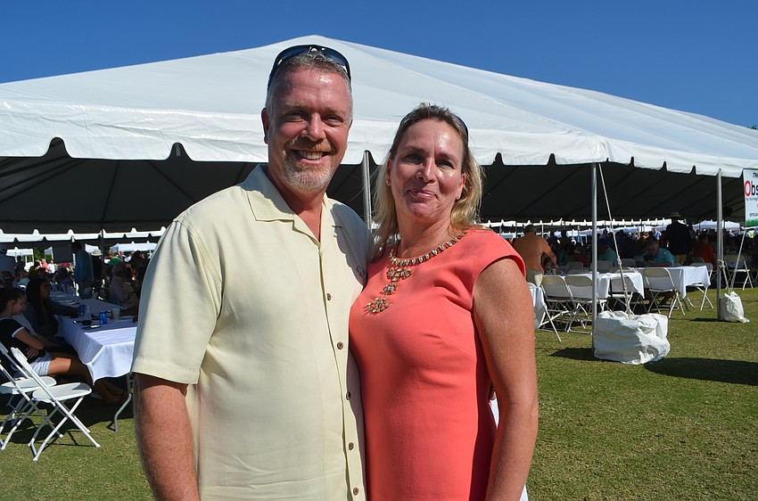 Ken Bevis and Lisa McNeight of event sponsor Waste Management