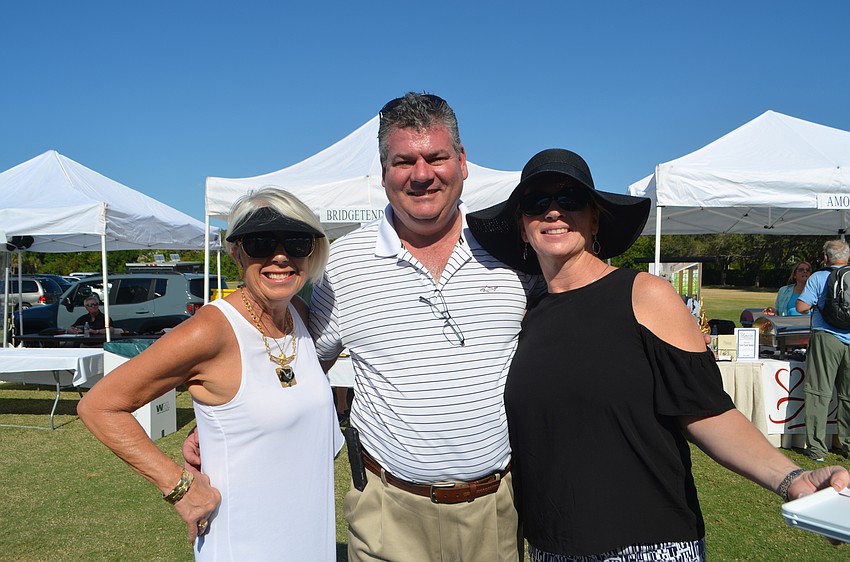 Jane Hunter, Bill Herlihy, propietor of Bridge Street Bistro and Island Time Bar & Grill, and Cherly Douma