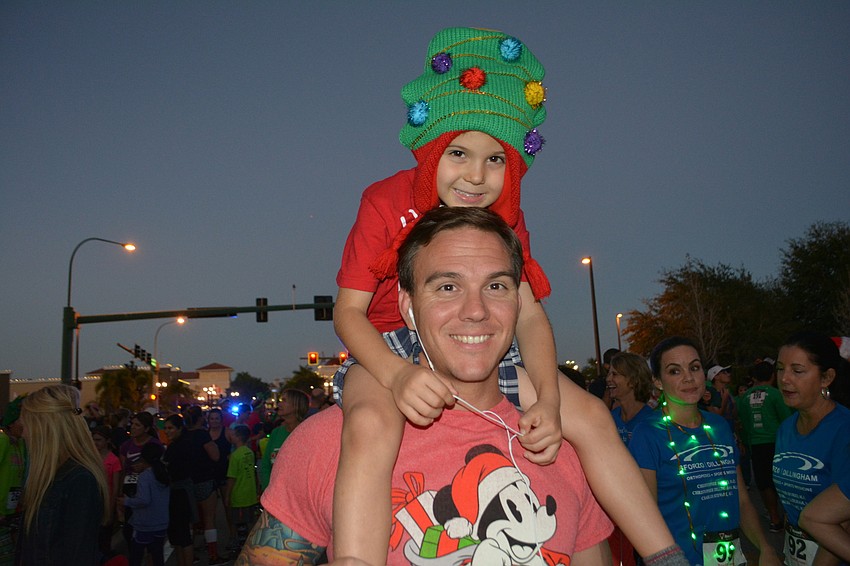 Five-year-old John Motzenbecker has the perfect seat aboard dad, Jared Motzenbecker.