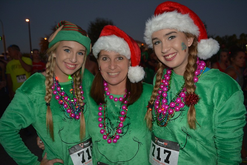 Kristen Gilray, Toni Gilray and Ashleigh Gilray get ready for the Jingle Bell Run.