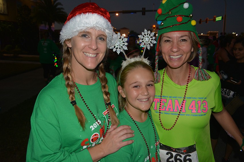 Amy Cates, Mary Cates and Sara Ochs share a moment before the start of the race.