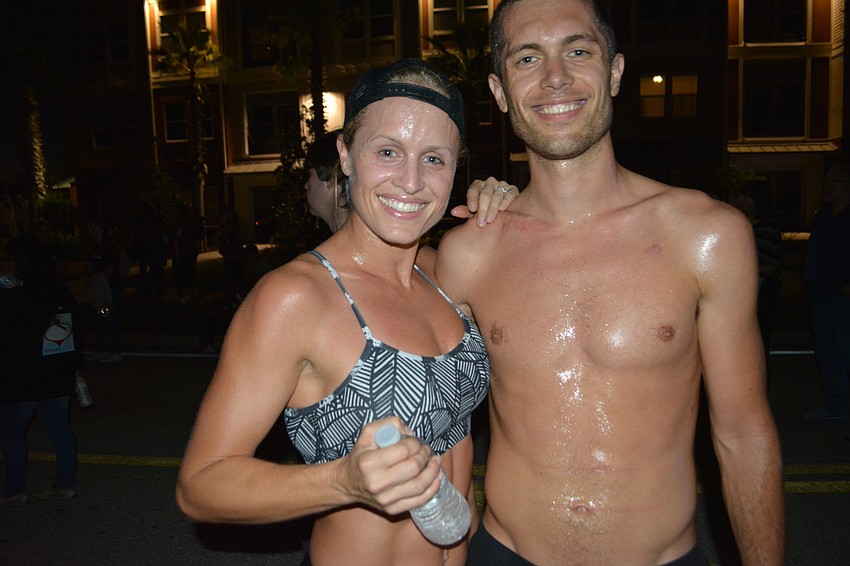 Jingle Bell women' s winner Kelly Jaco poses with her brother, overall race champion Bobby Sweeting. He won in 18:24.