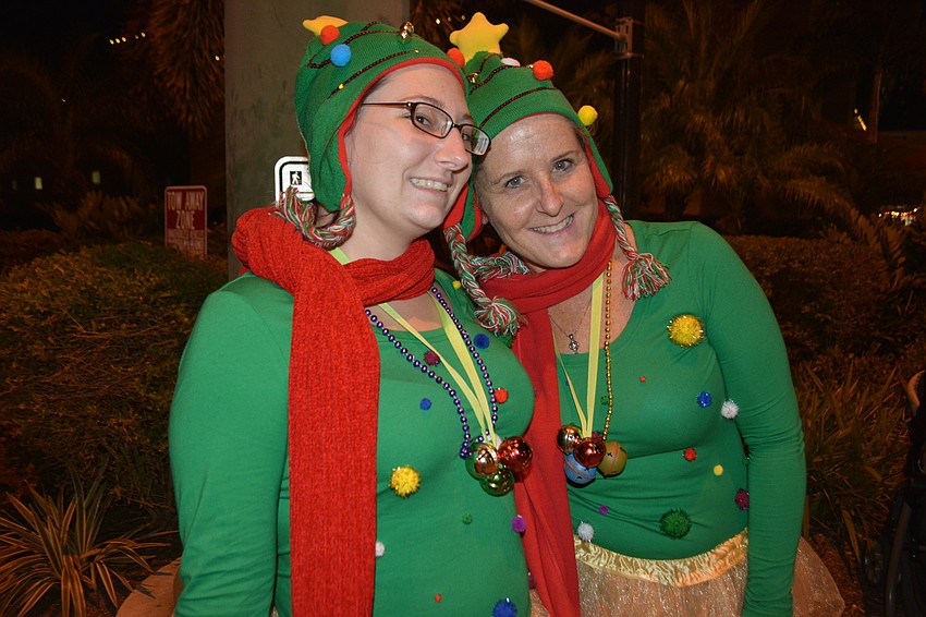 Volunteers Samantha Bradham and Laura Licoski judged the costume contest.