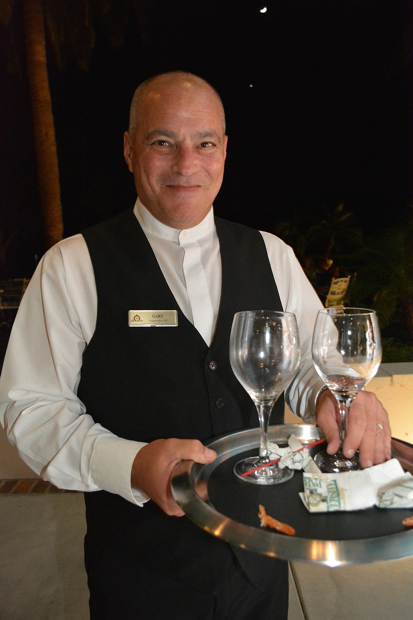 Gary Siegel assists guests with food and drink needs.