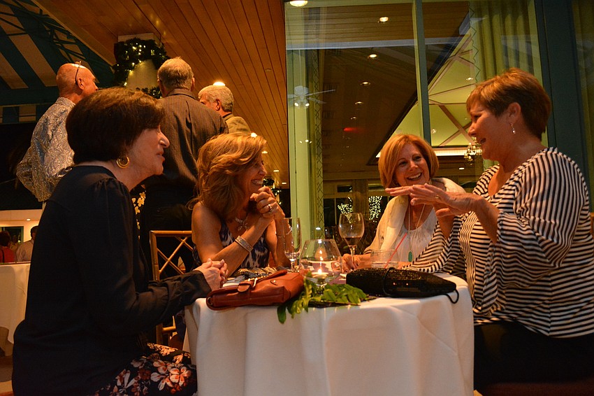 Joellen Grossman, Gail Synder, Dana Balionis and Sheila Cohen find a table away from the crowd to laugh together. Cohen is moving to Osprey, but the ladies say they'  ll still see each other regularly.