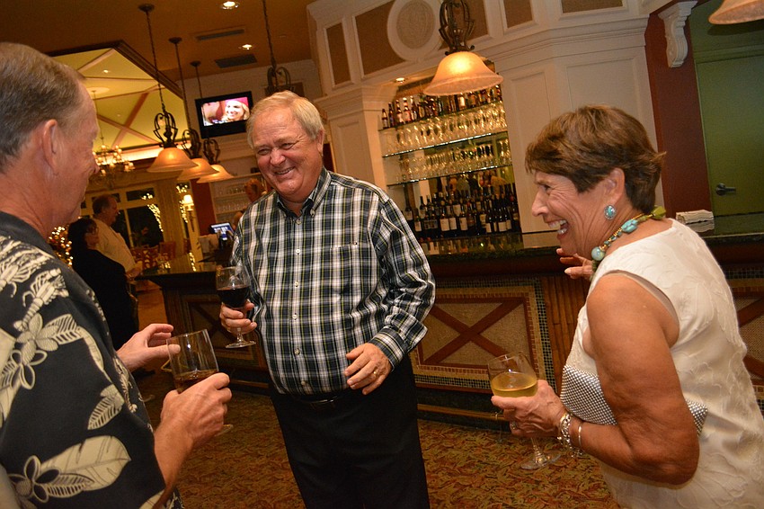 Gary Gunderson, center, shares a laugh with Maureen Ryan, right, and Bob Ryan, left.