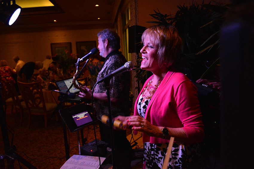 The band Double Vision provides live music. Pictured are saxaphonist Gene Cannon and singer Dianne Cutri.