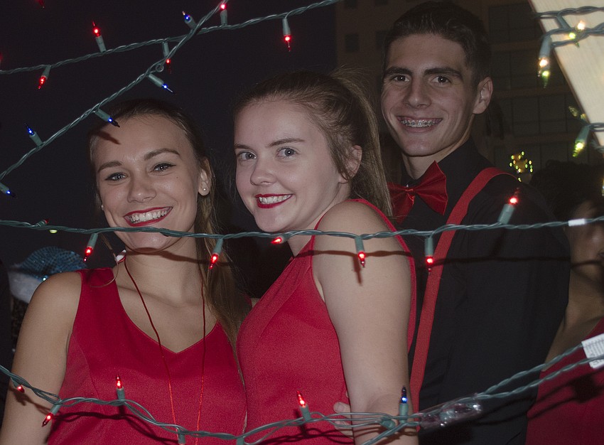 Kelsey Fisher, Lizzy House and Javier Negron road on the Sarasota High School theater group’s float.