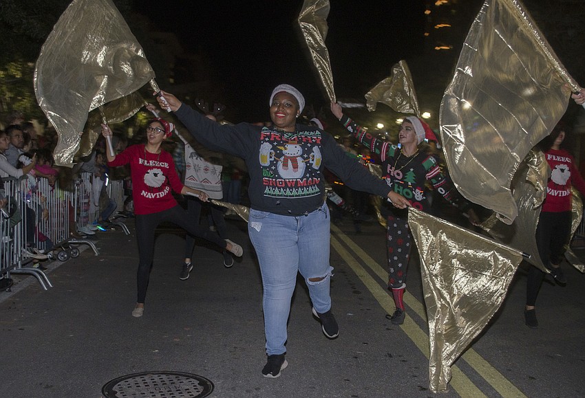 Booker High School color guard captain Imani Goddard dances in the downtown Holiday Parade.