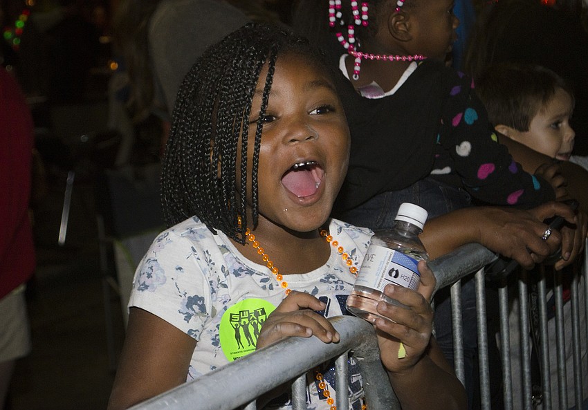 Armani Lee reacts to seeing the Big Cat Habitat float, which featured live lions and tigers.