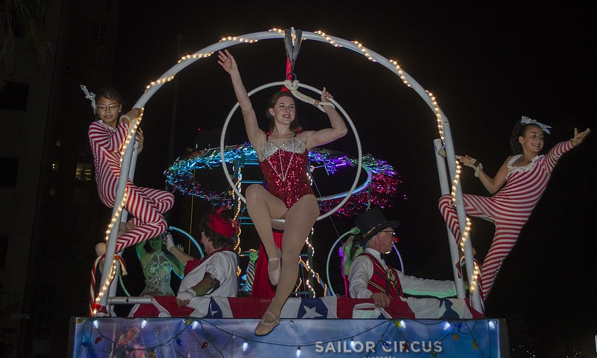 The Sarasota Circus Conservatory float makes its way down Main Street during the downtown Holiday Parade.