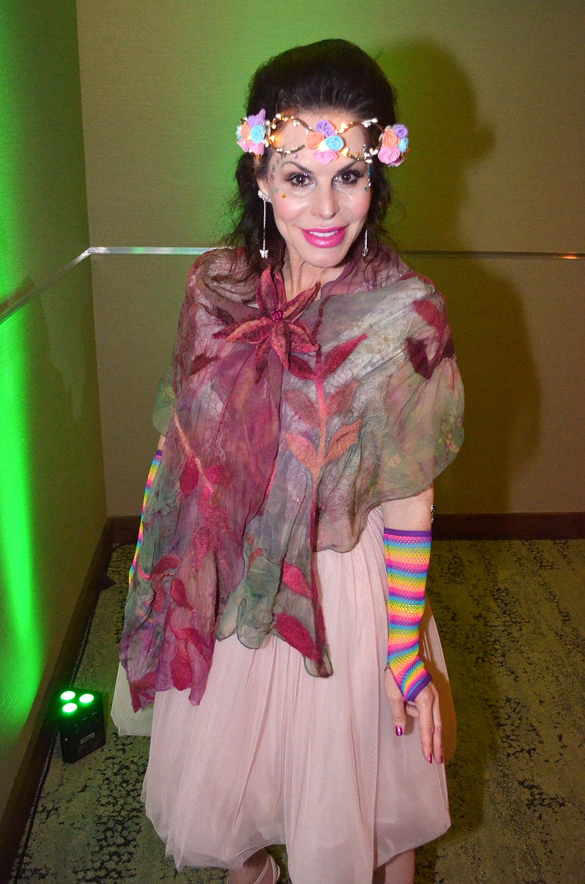 Lauren Walsh models her unique enchanted garden-themed ensemble.