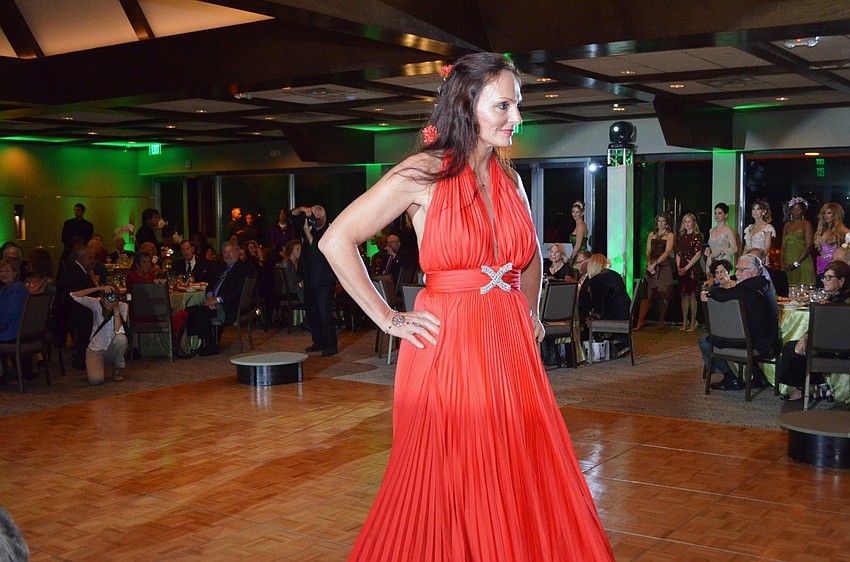 Anne Chauvet models a gown from Designing Women Boutique.