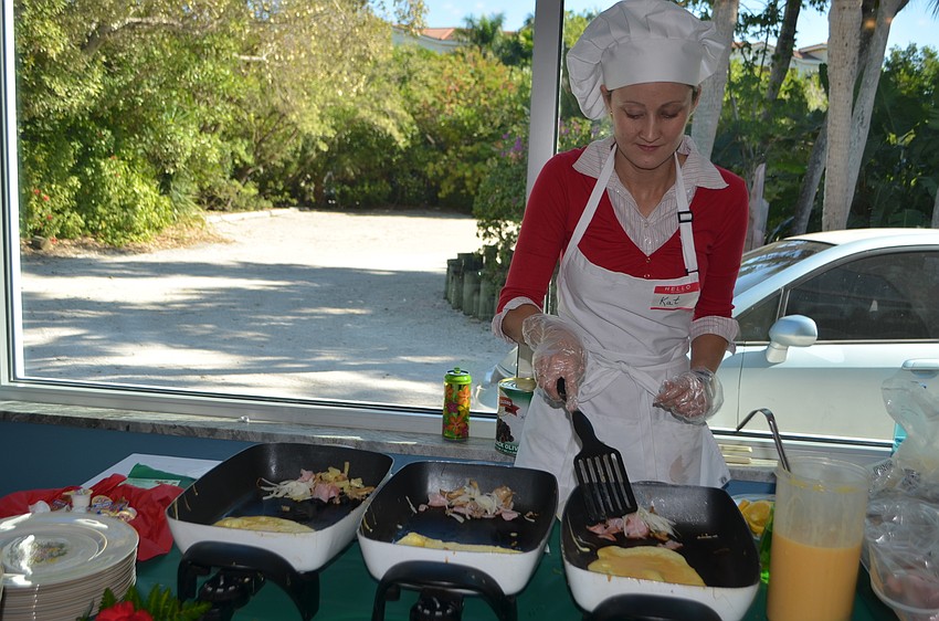 Kat Glenza cooks omelets for brunch attendees.