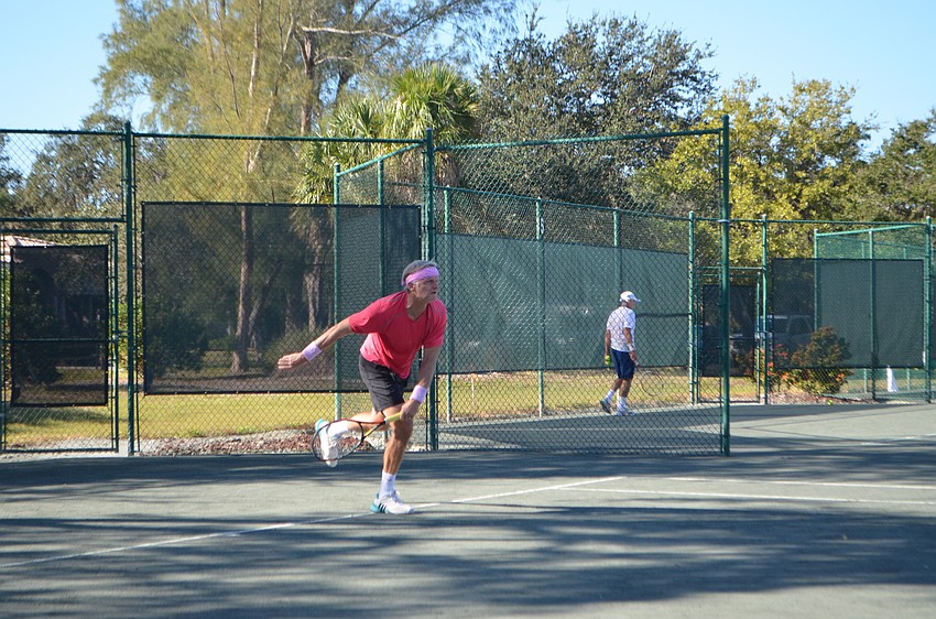 Erik-Jan Walson competes in the men’s 55 doubles finals.