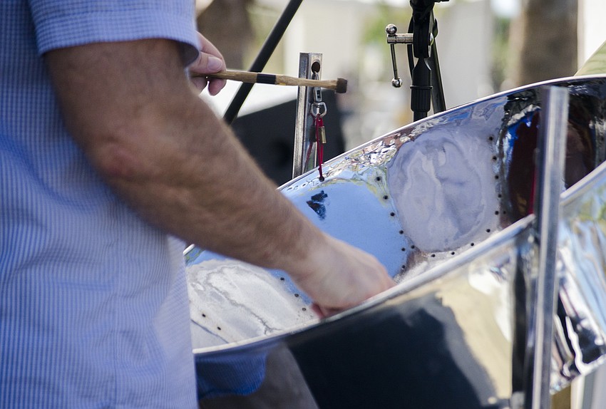 Cort Faris plays the steel drums during Sarasota Steel Pan Band'    s performance.