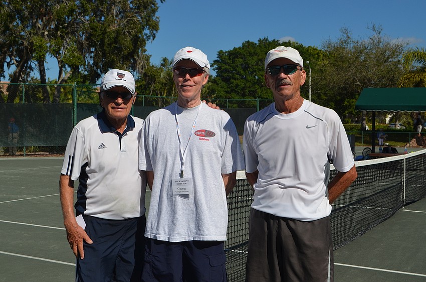 Men’s 75 singles winner Joseph Bachmann with tournament director George Bachman and Frank Hagelshaw