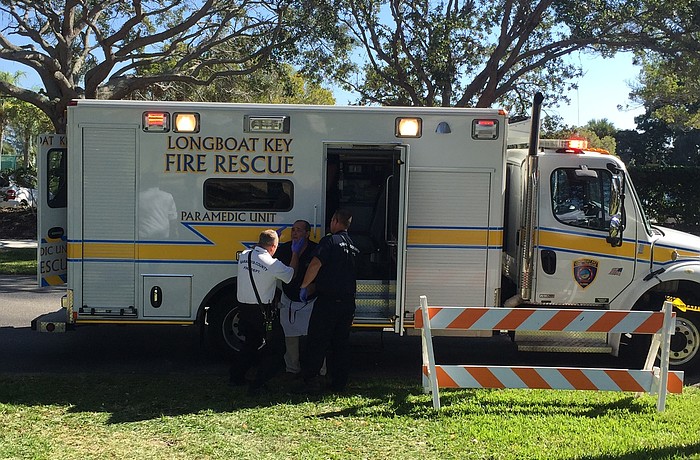 Paramedics inspect and treat a Mar Vista employee following the explosion of a fuel canister at the Kiwanis Club Gourmet Lawn Party on Dec. 3.
