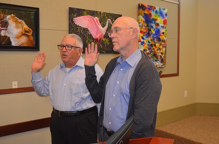 Commissioners Terry Gans, left, and Phill Younger, were sworn in Monday as mayor and vice mayor, respectively. Terry O'Connor