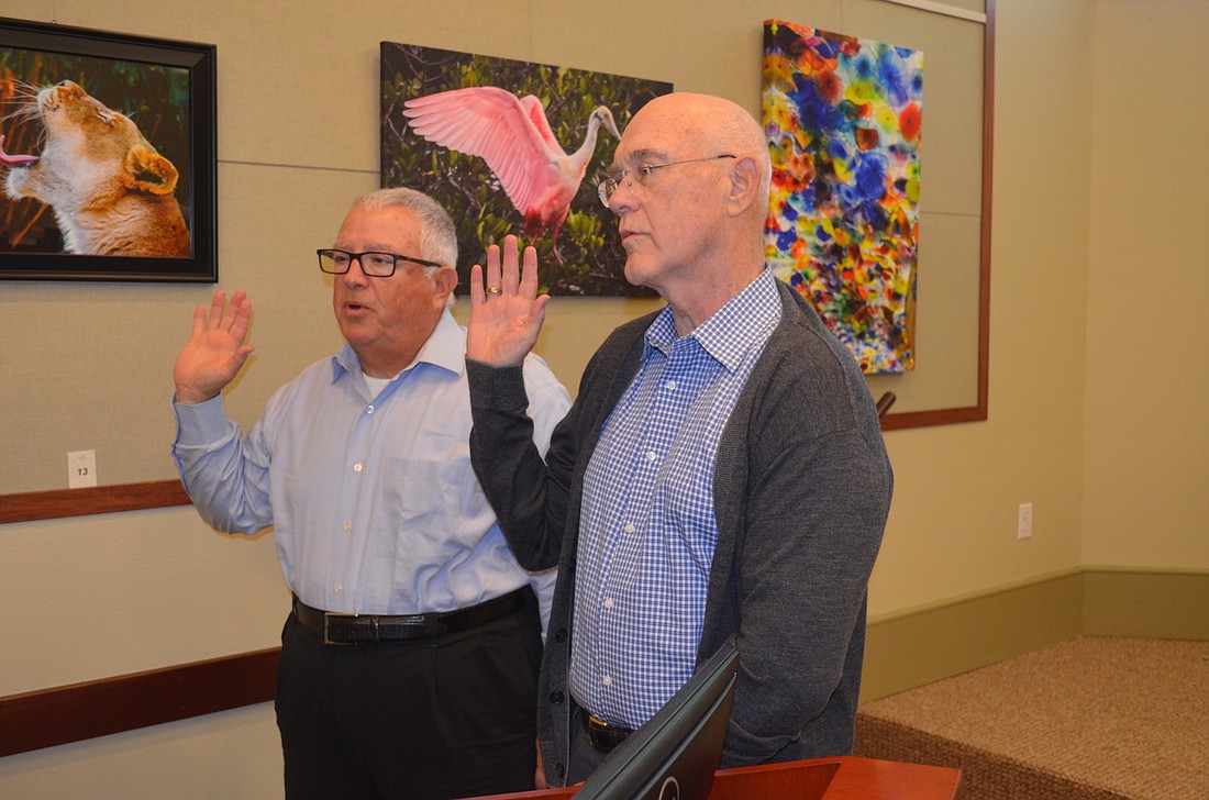 Commissioners Terry Gans, left, and Phill Younger, were sworn in Monday as mayor and vice mayor, respectively. Terry O'Connor