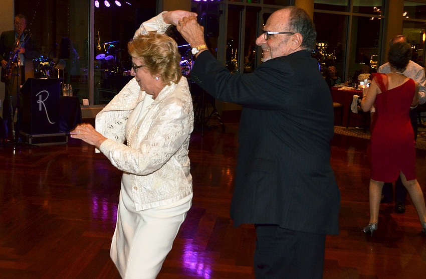Honorary Chairman and Sarasota Ballet Executive Director Joe Volpe twirls Katherine Martucci.