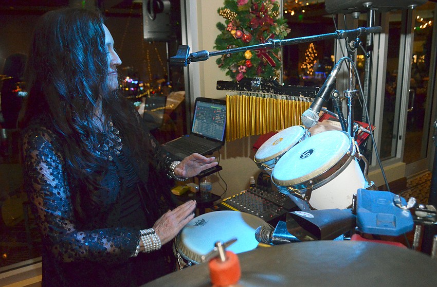 Percussionist/vocalist Heather Arden Roy performs with The Royz Band.