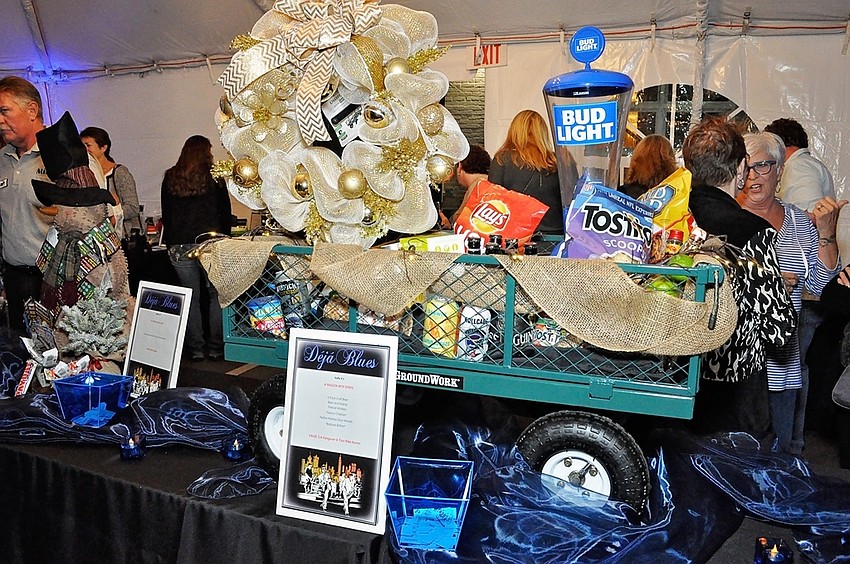 Auction items line the table outside The Grill at O-Bricks.