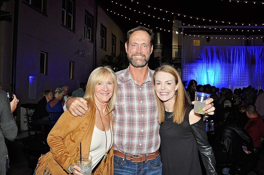Martha Ann Harrison with Mike and Julie Johnson.