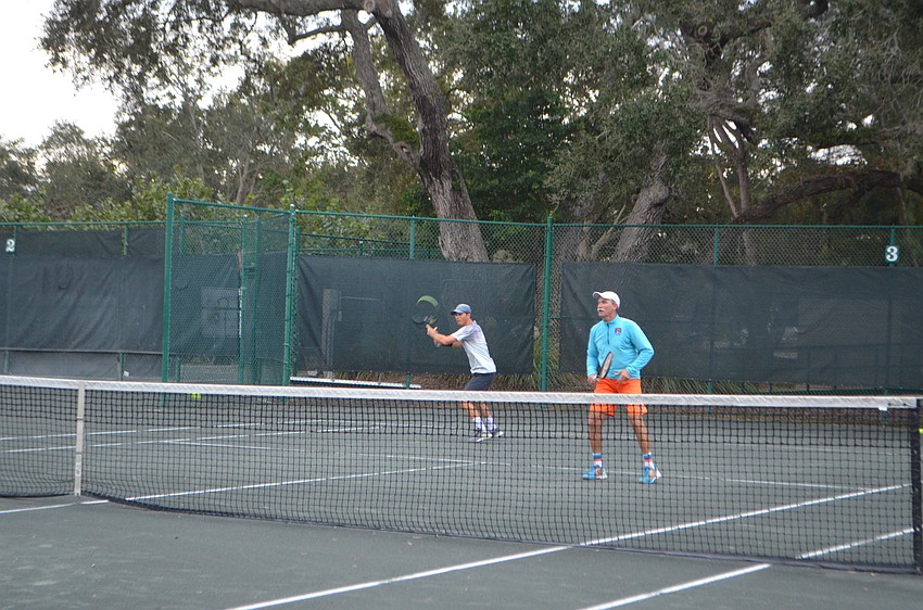 Claudiu Retean and Robbie Salum wait to receive the ball during the exhibition match for the Observer Challenge Tennis Tournament.