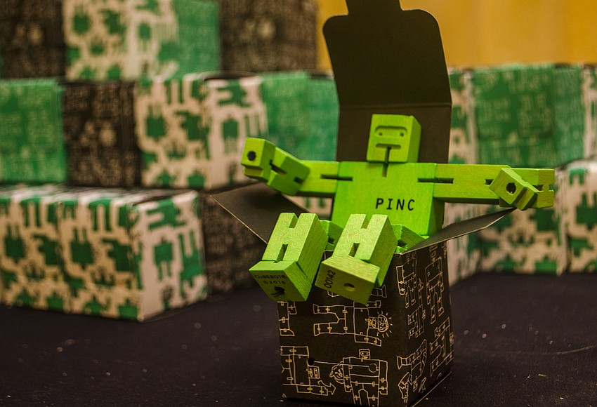 Attendees were given a robot figurine.