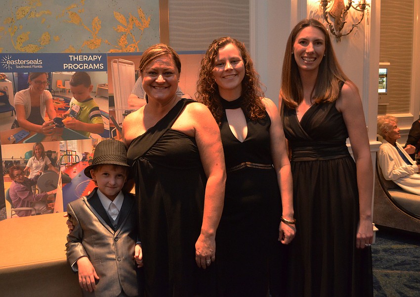 Cody with Easter Seals Therapy Program staff members Tracie Makin, Hannah Warne and Kristie Geimer