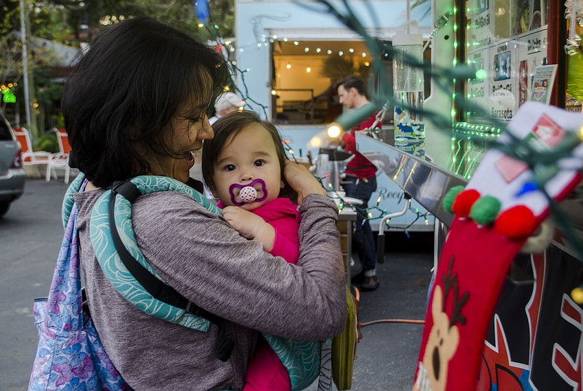 Krissy Murphy and Abby MurphyEach of the participating store owners set out treats for participants.