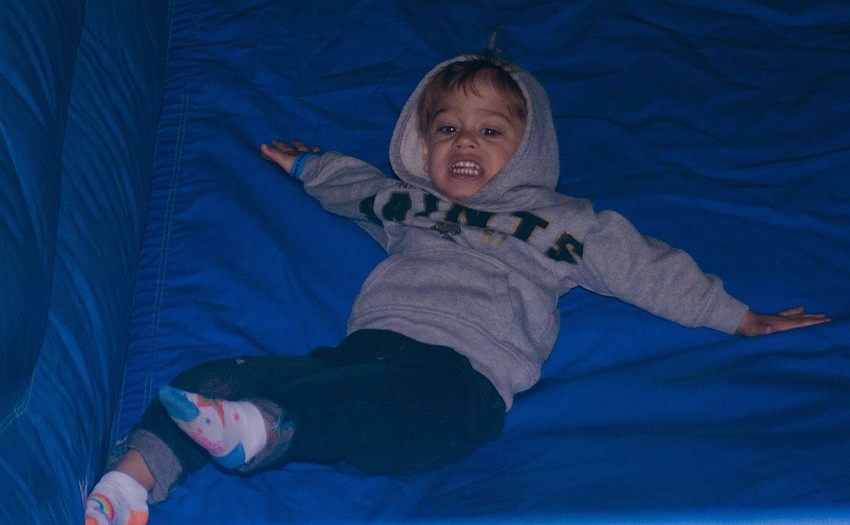 Nico Majori slides down the inflatable slide.